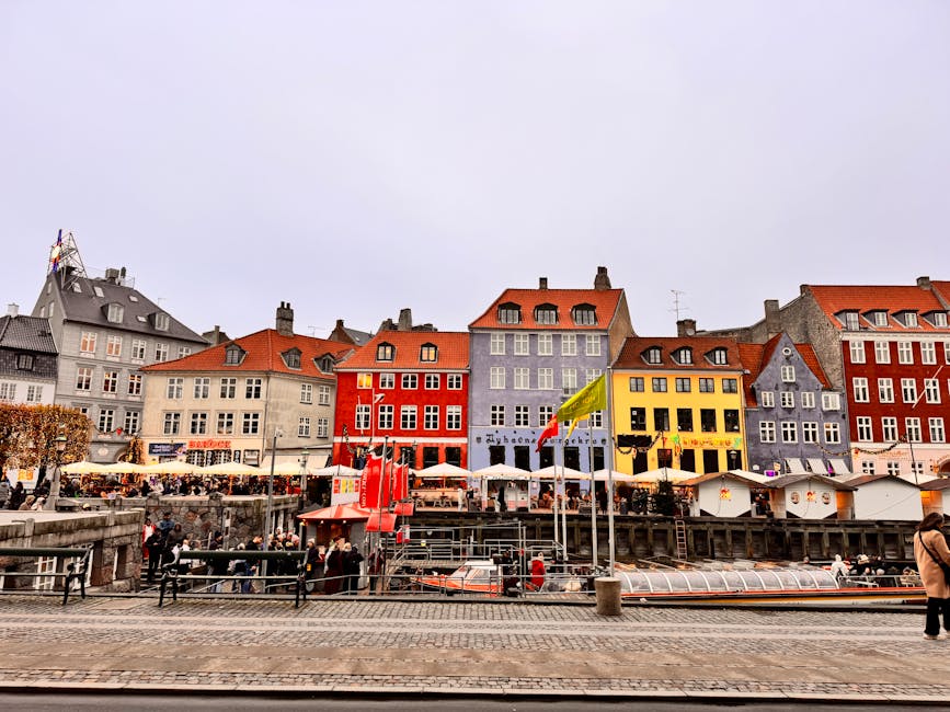 Colorful buildings along Nyhavn Harbor in Copenhagen, perfect for travel enthusiasts seeking unique cityscapes.
