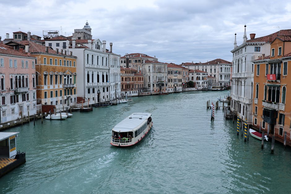 Explore the iconic canals of Venice, Italy, showcasing beautiful architecture and historic charm.