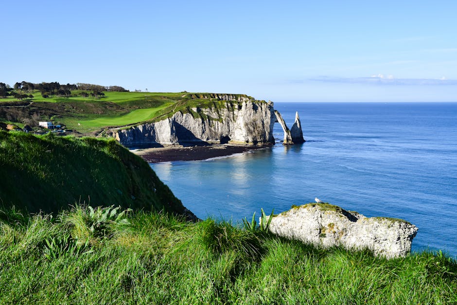 Stunning coastal view of Etretat's white cliffs and blue sea in Normandy, France, perfect for travel and nature enthusiasts.
